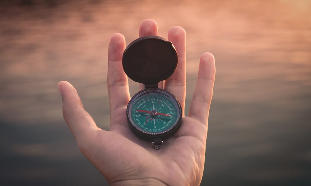 Compass in palm of hand - Aron Visuals 320023 Unsplash 1